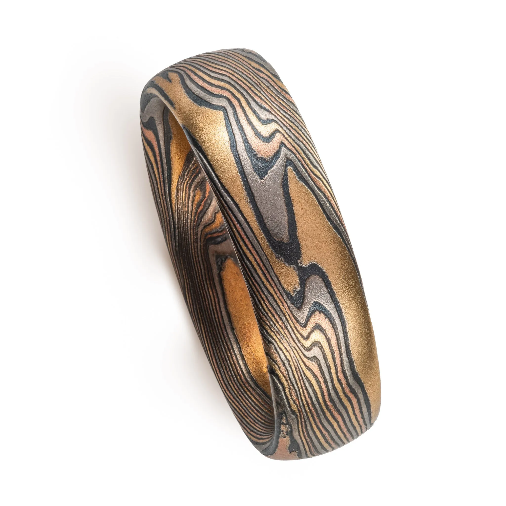 Woodsy Mokume Gane Ring Set in Firestorm Palette and Twist Pattern with Montana Sapphire