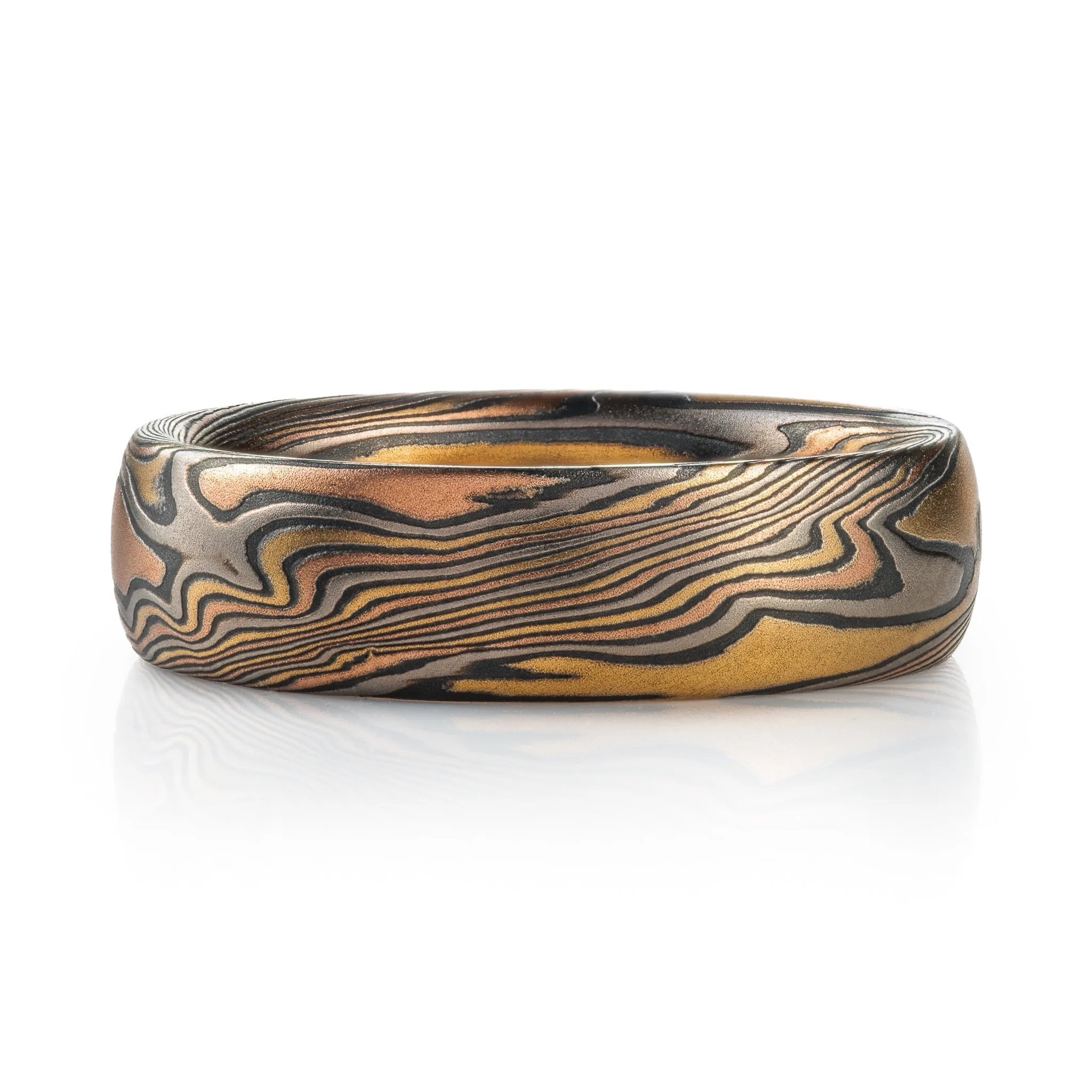 Woodsy Mokume Gane Ring Set in Firestorm Palette and Twist Pattern with Montana Sapphire